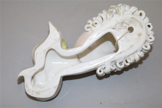 A Goldscheider mask of a lady holding a fruit, 8in.